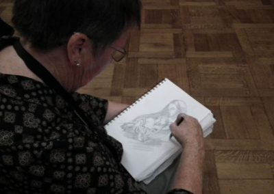 Woman sketching a painting from the Ormonde Collection.